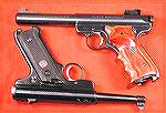 A couple of MK-II''s, a bull barrel with target grips, and the 50th Anniversary model, stock.Two Ruger MK-II PistolsJohn Will