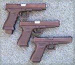 3 Glock 35s: the top pistol is customized and hand fitted with a Bar-Sto barrel. The middle 35 is set up for carry. The bottom 35 is stock except for Heinie sights.